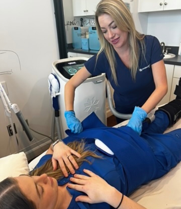 Cool Renewal Med Spa worker performing a body contouring treatment for a client